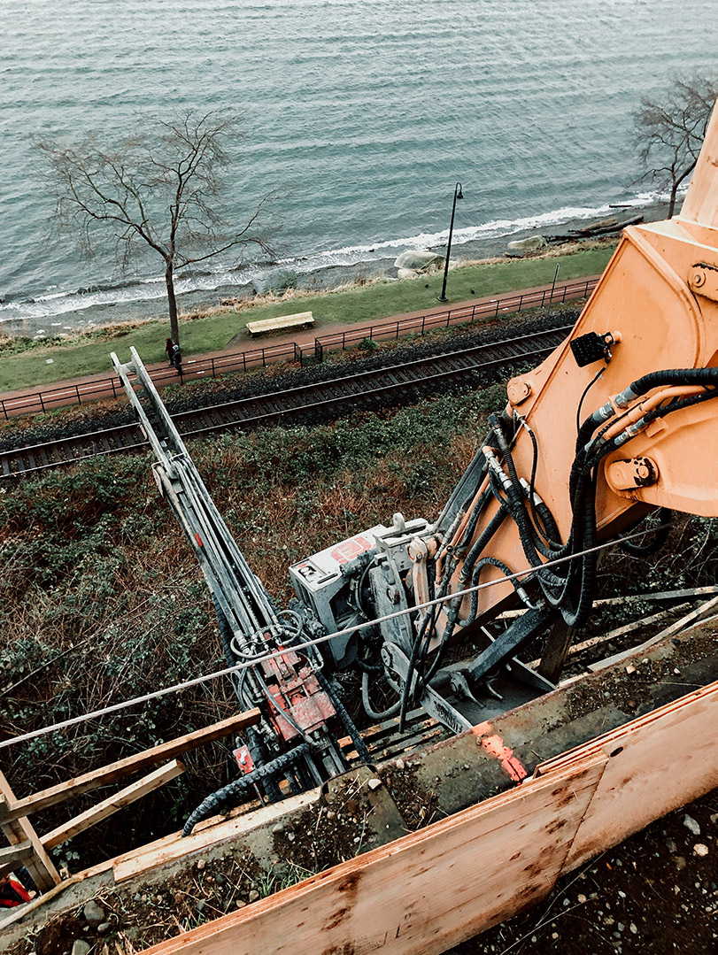 White Rock, BC drilling into retaining wall and slope